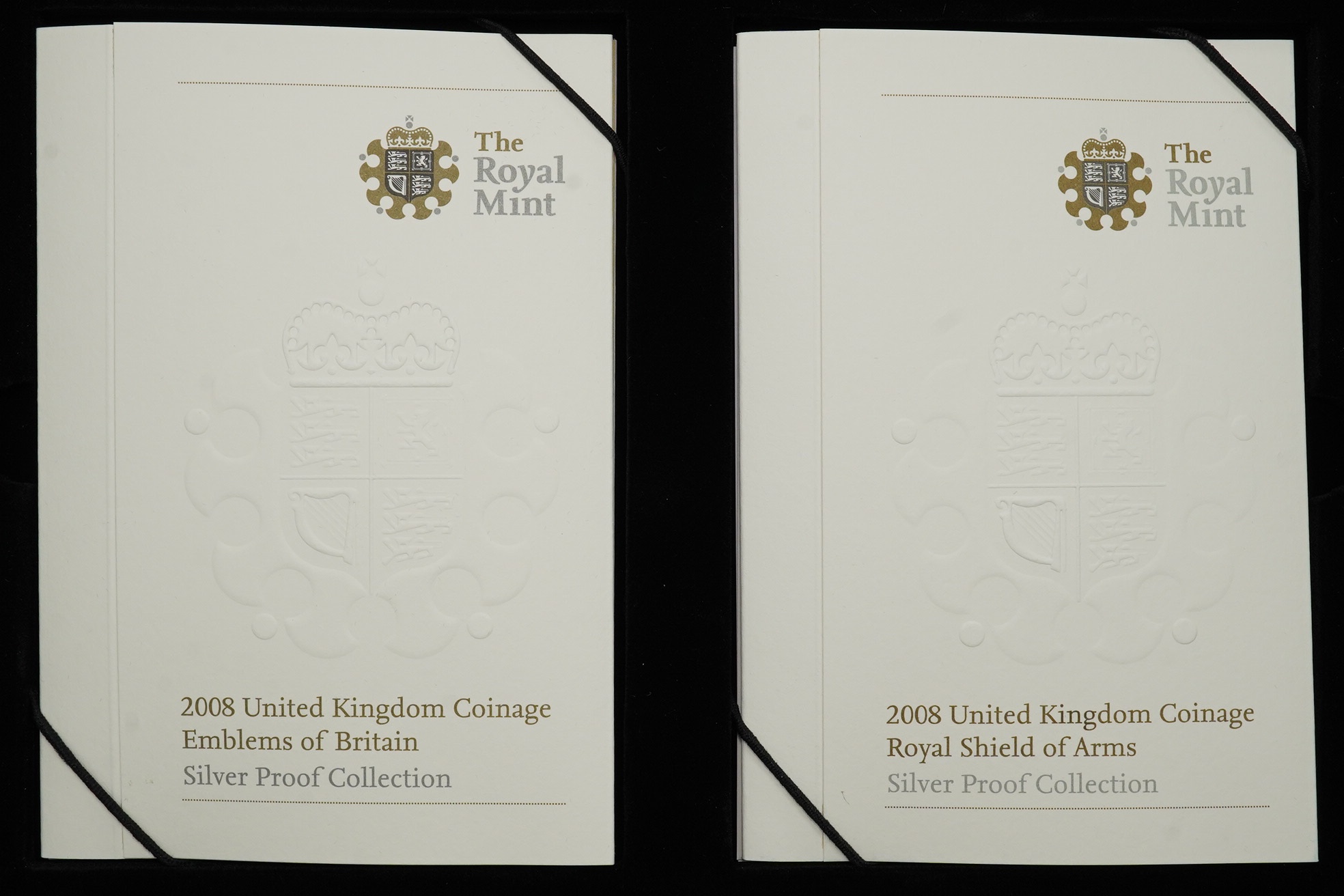 Royal Mint UK QEII coins, 2008 UK coinage Emblems of Britain and Royal Shield of Arms silver proof collection, cased together with certificates of issue and 25th anniversary £1 coin silver proof collection comprising 14